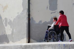 woman sitting on gray wheelchair