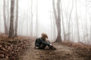 woman sitting on land