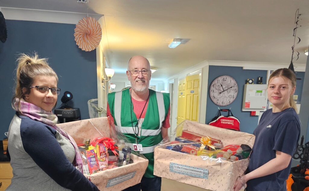 Staff with boxes of donations to Fair Frome Food Bank