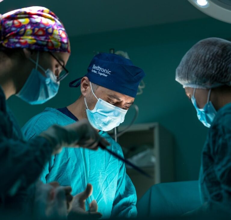 a group of doctors performing surgery in an operating room