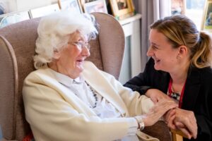 Betsey, a resident at Alba Rose Care Home in Pickering where Earzz has been trialled, with care home manager Tanya Wormald, photo courtesy of Saint Cecilia's Care Group