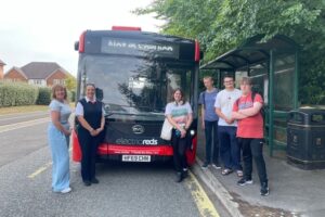 Participants in the Travel Training videos with a Salisbury Reds bus, image courtesy of Wiltshire Council
