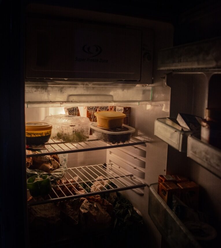 white refrigerator with food inside
