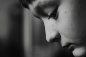 a black and white photo of a young man