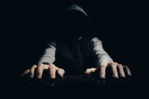 a person with their hands on a keyboard