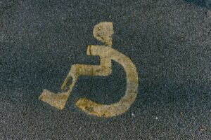 a handicapped sign is painted on the pavement